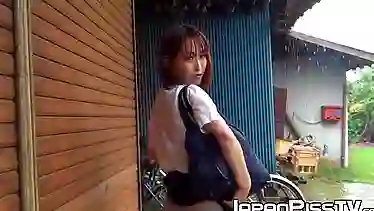 Japanese schoolgirl soaks her panties up at a rainy day