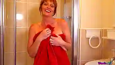 Mature bombshell strips down and teases in lingerie for unexpected visit